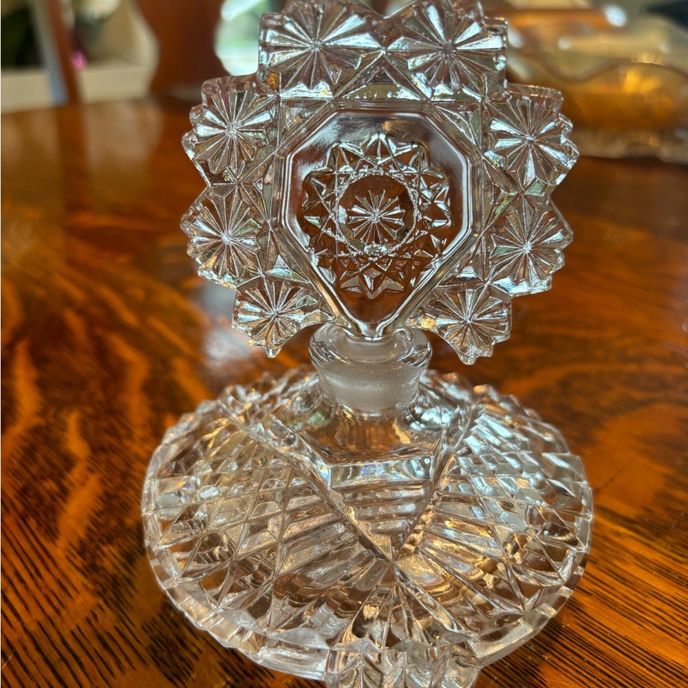 vintage crystal clear perfume bottle with a decorative stopper